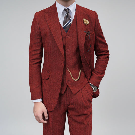 Red suit with a white shirt and patterned tie on a white background