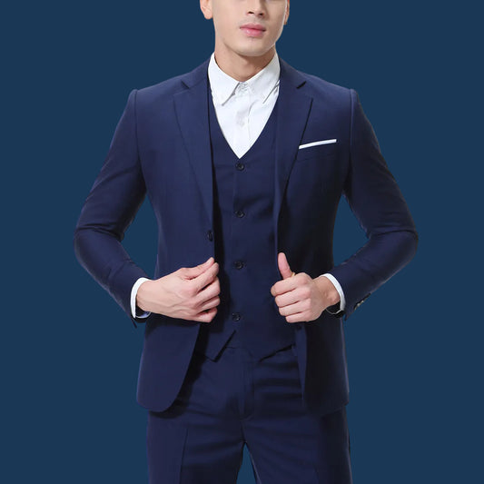 Man wearing a navy blue suit with a white shirt on a white background