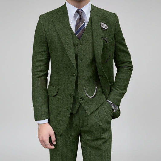 Green suit with a tie and pocket square on a white background