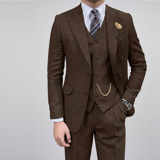 Brown suit with a tie and pocket square on a white background