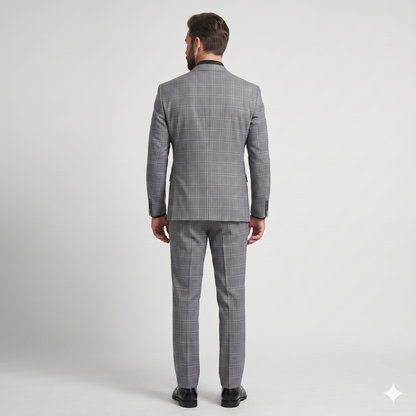 Man wearing a gray checkered suit on a white background