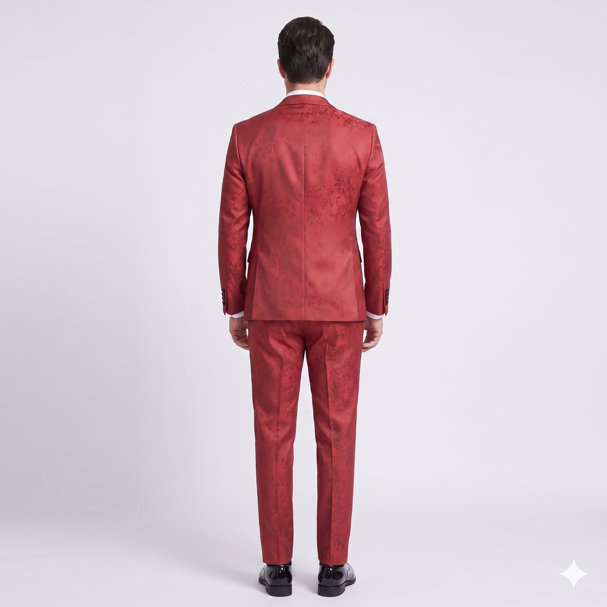 Red suit worn by a person on a white background