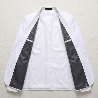 White blazer with black accents on a light gray background