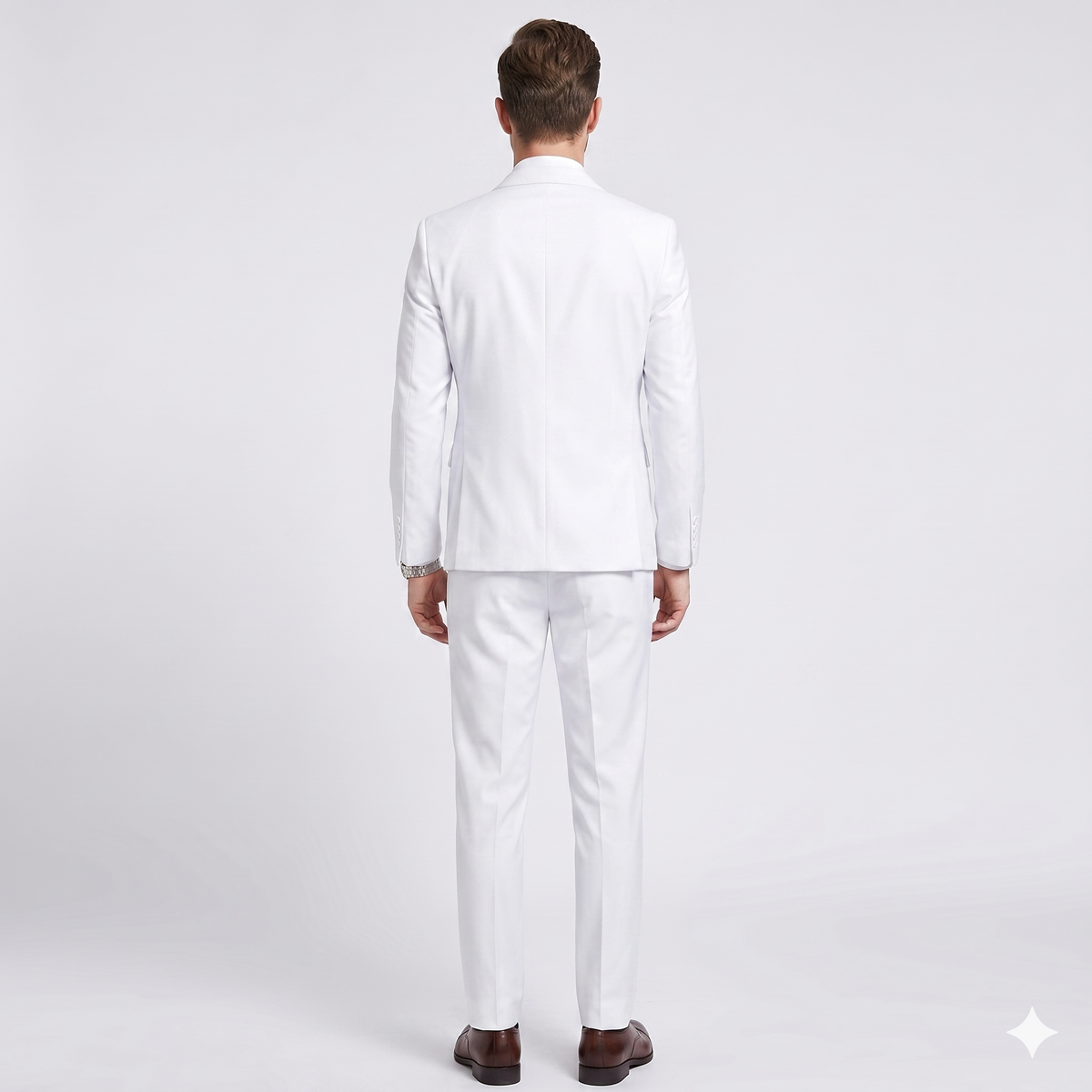 Man wearing a white suit on a light gray background