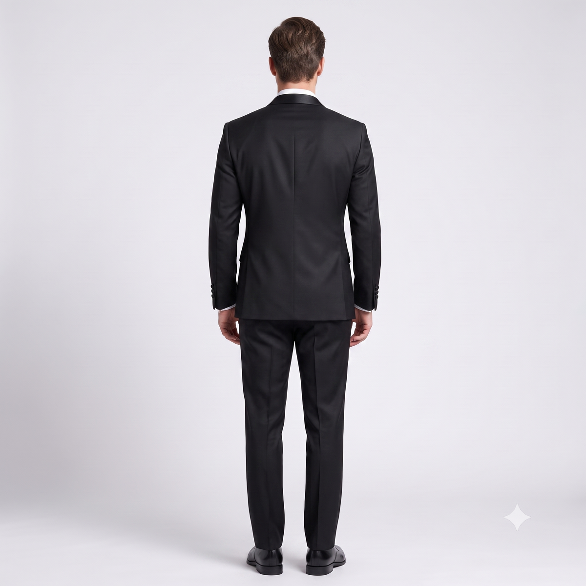 Man wearing a black suit on a white background