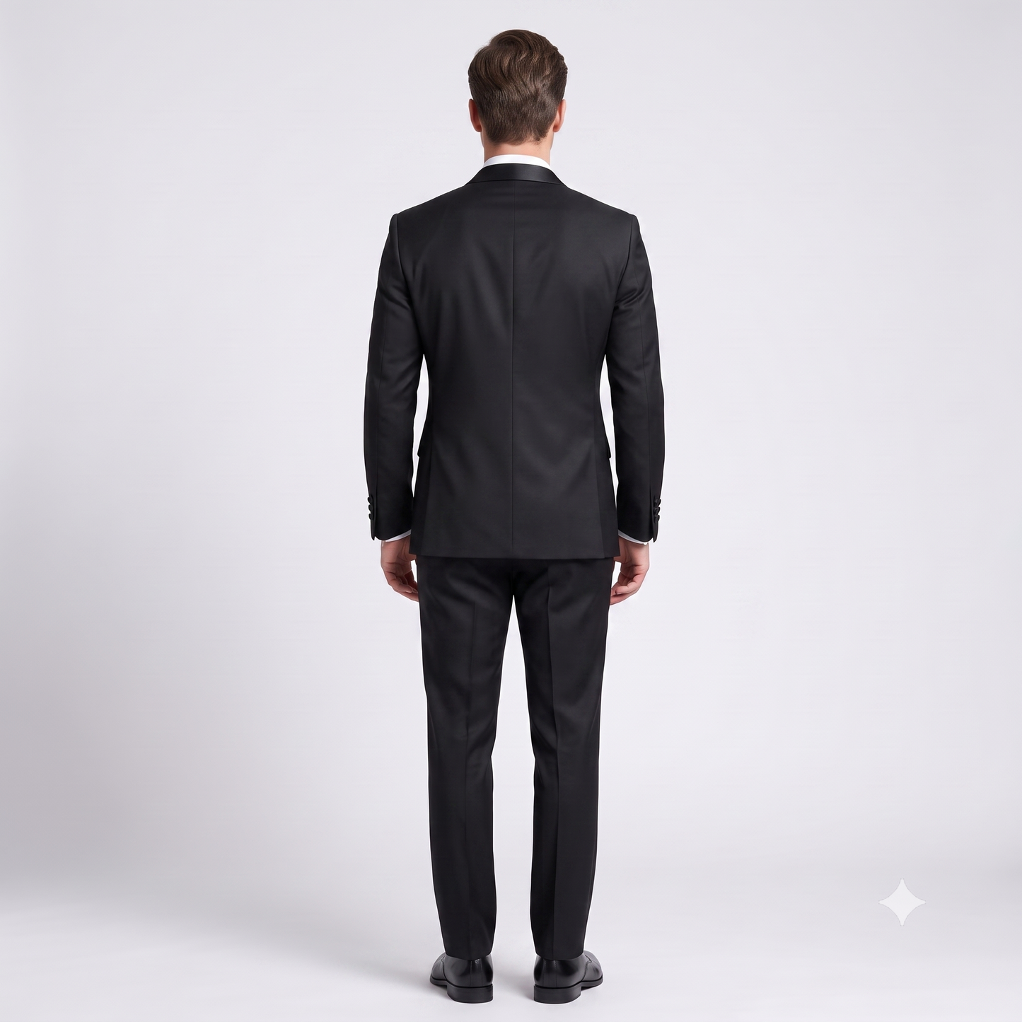 Man wearing a black suit on a white background