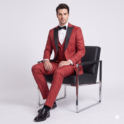 Man in a red suit sitting on a black chair against a white background