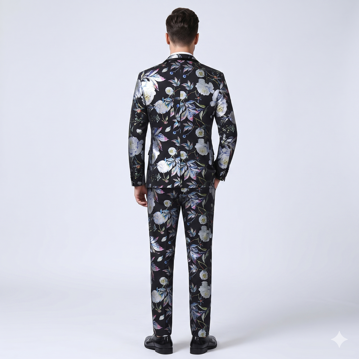 Man wearing a floral-patterned suit on a white background