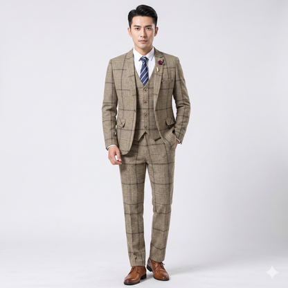 Man wearing a beige checkered suit with a white shirt and striped tie on a light gray background