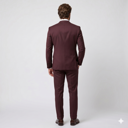 Man wearing a burgundy suit on a white background