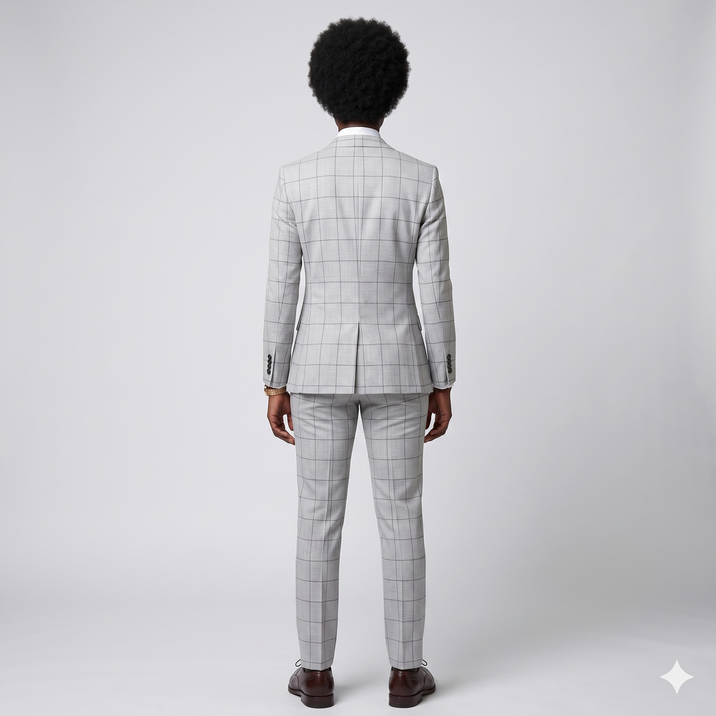 Person wearing a gray checkered suit on a white background