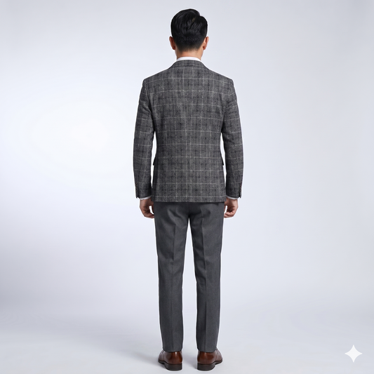 Man wearing a gray checkered suit on a white background