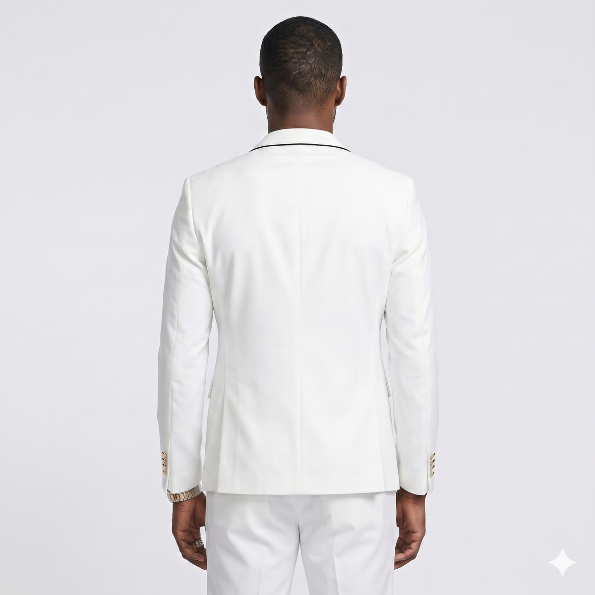 Man wearing a white suit on a light gray background