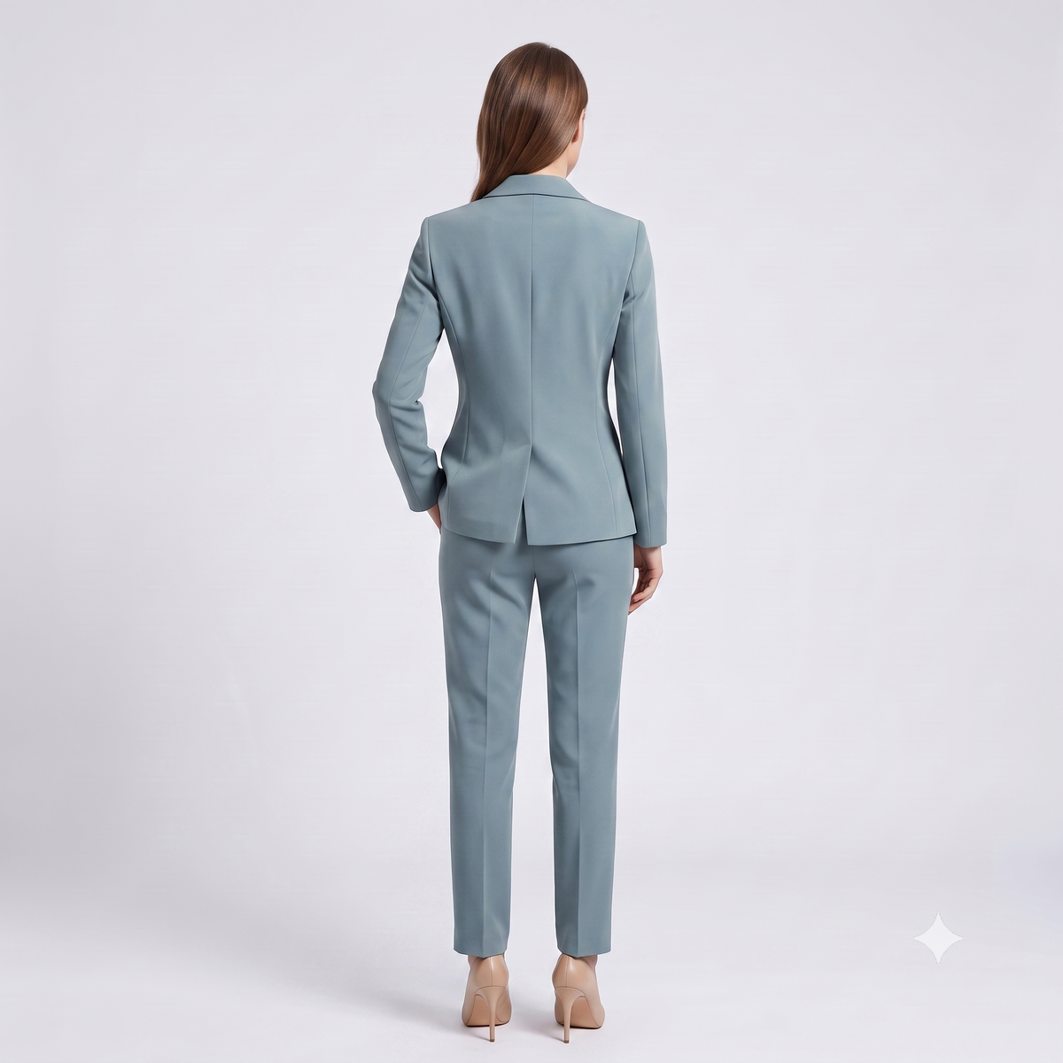 Woman wearing a light blue suit on a white background