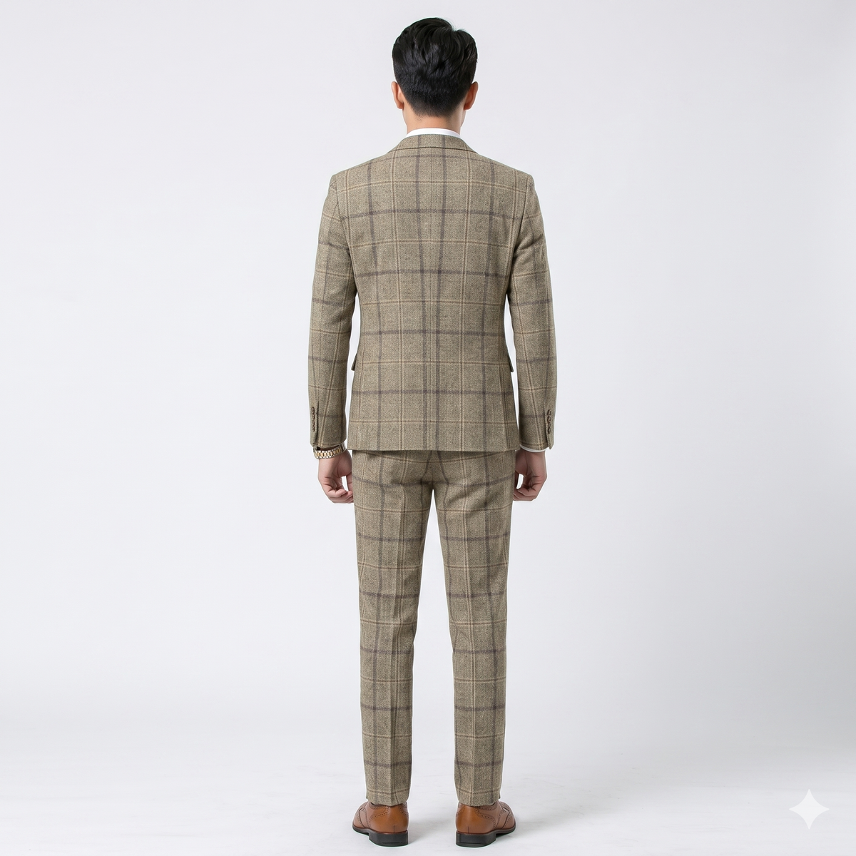 Man wearing a checkered suit on a white background