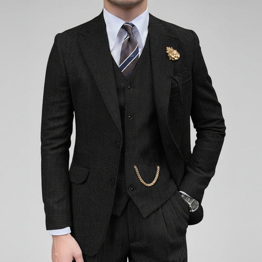 Dark gray suit with vest and tie on a white background