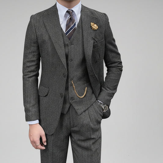 Gray suit with a tie and pocket square on a white background