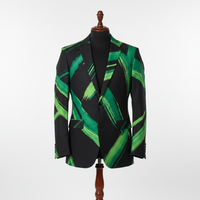Men’s statement blazer displayed upright on a wooden stand. Slim-fit jacket crafted in black fabric with bold green abstract brush-stroke lines throughout, finished with a notched lapel and single-button closure. Clean studio background with soft, even lighting highlighting the pattern and texture 250:250