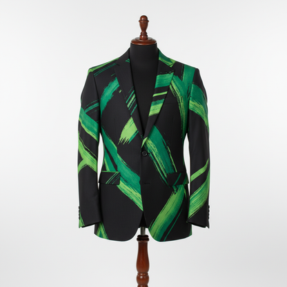 Men’s statement blazer displayed upright on a wooden stand. Slim-fit jacket crafted in black fabric with bold green abstract brush-stroke lines throughout, finished with a notched lapel and single-button closure. Clean studio background with soft, even lighting highlighting the pattern and texture 250:250