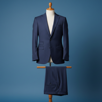 Navy blue suit on a mannequin against a blue background