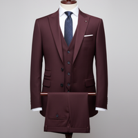 Maroon suit with a blue tie on a mannequin against a gray background